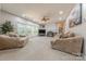 Large living room features a fireplace, plenty of natural light, and comfortable seating arrangement, great for gatherings at 5707 Fairvista Dr, Charlotte, NC 28269