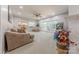 Spacious living room featuring a fireplace, large windows, and neutral decor, perfect for comfortable living at 5707 Fairvista Dr, Charlotte, NC 28269