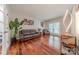 Spacious living room with hardwood floors, modern lighting, and ample seating at 5707 Fairvista Dr, Charlotte, NC 28269