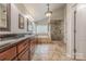 Luxurious main bathroom features a double vanity, glass enclosed shower and separate soaking tub at 5707 Fairvista Dr, Charlotte, NC 28269