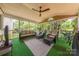 Relaxing screened porch with outdoor seating and a ceiling fan at 5707 Fairvista Dr, Charlotte, NC 28269