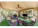 Inviting screened porch with comfortable seating and outdoor dining area at 5707 Fairvista Dr, Charlotte, NC 28269