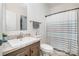 Bathroom featuring a vanity with granite-look countertops, toilet, mirror, and shower/tub combination at 5720 Enochville School Rd, Kannapolis, NC 28081