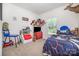 A bedroom decorated with toys, a flatscreen TV, and a baseball themed bed at 5720 Enochville School Rd, Kannapolis, NC 28081