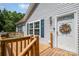Home entryway with deck, blue shutters, and white door at 5720 Enochville School Rd, Kannapolis, NC 28081