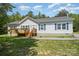 Charming single story home featuring a covered deck and beautiful landscaping at 5720 Enochville School Rd, Kannapolis, NC 28081
