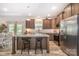 Open kitchen area with stainless steel appliances and island with bar seating at 5720 Enochville School Rd, Kannapolis, NC 28081