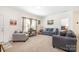 Living room with gray sofas and carpeted floors at 5720 Enochville School Rd, Kannapolis, NC 28081