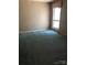 A carpeted bedroom featuring a window at 5727 Dockside Dr, Charlotte, NC 28227