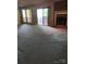 View of living room featuring a brick fireplace and a sliding glass door leading to the outside deck at 5727 Dockside Dr, Charlotte, NC 28227