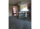 View of living room featuring kitchen with breakfast bar and doorway to front entrance at 5727 Dockside Dr, Charlotte, NC 28227