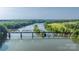 Stunning aerial view of the river, showcasing bridges, lush green trees, and open fields at 5888 Wood Duck Way, Catawba, NC 28609