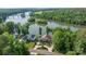 Stunning aerial view of waterfront homes with manicured lawns and beautiful landscaping overlooking the Catawba River at 5888 Wood Duck Way, Catawba, NC 28609