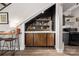 Cozy bar area under stairs with a counter for drinks, and wine storage at 5888 Wood Duck Way, Catawba, NC 28609