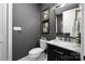 Stylish powder room with marble countertop vanity, modern fixtures, and decorative wall art at 5888 Wood Duck Way, Catawba, NC 28609