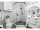 Modern bathroom featuring a glass-enclosed shower with marble tiling, complemented by updated fixtures and a vanity at 5888 Wood Duck Way, Catawba, NC 28609