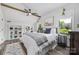 Bedroom with exposed beam, large windows, and built-in shelving at 5888 Wood Duck Way, Catawba, NC 28609