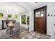 Bright dining room with a wooden table, stylish chandelier, and natural light at 5888 Wood Duck Way, Catawba, NC 28609