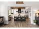 Beautiful kitchen boasts dark island, stainless steel appliances, pendant lighting and wood grain floors at 5888 Wood Duck Way, Catawba, NC 28609