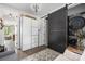 Chic laundry room with stacked washer/dryer, custom storage, and barn door at 5888 Wood Duck Way, Catawba, NC 28609