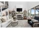 Spacious living room with a fireplace, high ceilings, large windows and comfortable seating at 5888 Wood Duck Way, Catawba, NC 28609