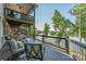Balcony with comfortable seating to enjoy lovely view of the river and the trees at 5888 Wood Duck Way, Catawba, NC 28609