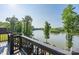 Scenic view of a river and bridge from a balcony, surrounded by lush green trees at 5888 Wood Duck Way, Catawba, NC 28609