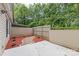 Enclosed private backyard with a stone path and mulched garden area at 5949 Quail Hollow Rd # E, Charlotte, NC 28210