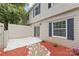 Enclosed private backyard with a stone path and sliding door at 5949 Quail Hollow Rd # E, Charlotte, NC 28210