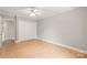Light and airy bedroom with laminate floors and a large closet at 5949 Quail Hollow Rd # E, Charlotte, NC 28210