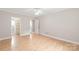 Large bedroom featuring wood floors and en-suite bathroom and closet at 5949 Quail Hollow Rd # E, Charlotte, NC 28210