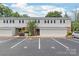 Inviting two-story townhouse with dedicated parking spots and landscaped grounds at 5949 Quail Hollow Rd # E, Charlotte, NC 28210