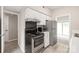 View of kitchen featuring sleek appliances and lots of natural light at 5949 Quail Hollow Rd # E, Charlotte, NC 28210