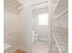 Walk-in closet with lots of storage leading to en-suite bathroom at 5949 Quail Hollow Rd # E, Charlotte, NC 28210
