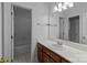 Clean, bright bathroom with white tiling, a vanity with modern fixtures, and a tiled shower/tub at 654 9Th N St, Albemarle, NC 28001
