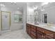 Bright primary bathroom with double vanities, and separate shower and tub at 654 9Th N St, Albemarle, NC 28001