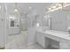 This updated bathroom features dual vanities, natural light, and a separate shower at 654 9Th N St, Albemarle, NC 28001