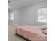 Clean, neutral bedroom with carpet flooring, windows providing natural light, and white trim at 654 9Th N St, Albemarle, NC 28001