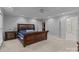 Primary bedroom with a tray ceiling, detailed furnishings, and ensuite bath at 654 9Th N St, Albemarle, NC 28001