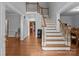 Grand foyer with a staircase, hardwood floors, and bright, neutral decor at 654 9Th N St, Albemarle, NC 28001