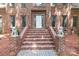 Stately brick home with front entrance, elegant walkway, and decorative lion statues at 654 9Th N St, Albemarle, NC 28001