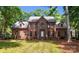 Charming two-story brick home with mature trees and a well-manicured front yard at 654 9Th N St, Albemarle, NC 28001