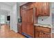 The kitchen includes custom wood cabinetry and a built-in refrigerator at 654 9Th N St, Albemarle, NC 28001