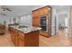 Kitchen with stainless steel double oven, granite countertops, and hardwood flooring at 654 9Th N St, Albemarle, NC 28001