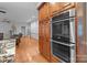 Spacious kitchen featuring double oven and wooden cabinets for ample storage space at 654 9Th N St, Albemarle, NC 28001