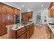 Well-equipped kitchen with granite countertops, stainless steel appliances, and a center island at 654 9Th N St, Albemarle, NC 28001