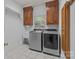 Spacious laundry room with modern washer and dryer units and natural light at 654 9Th N St, Albemarle, NC 28001