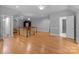 Spacious bonus room with hardwood floors, half wall staircase, and natural light at 654 9Th N St, Albemarle, NC 28001