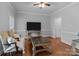 Bright living room with hardwood floors, elegant furniture, and a large window at 654 9Th N St, Albemarle, NC 28001