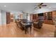 Open-concept living room with hardwood floors, built-in shelving, and great lighting at 654 9Th N St, Albemarle, NC 28001